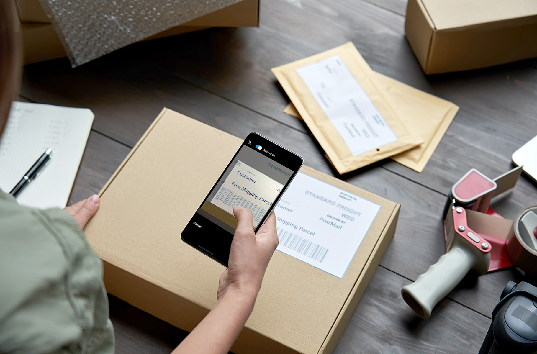 Employee scanning barcode on box 